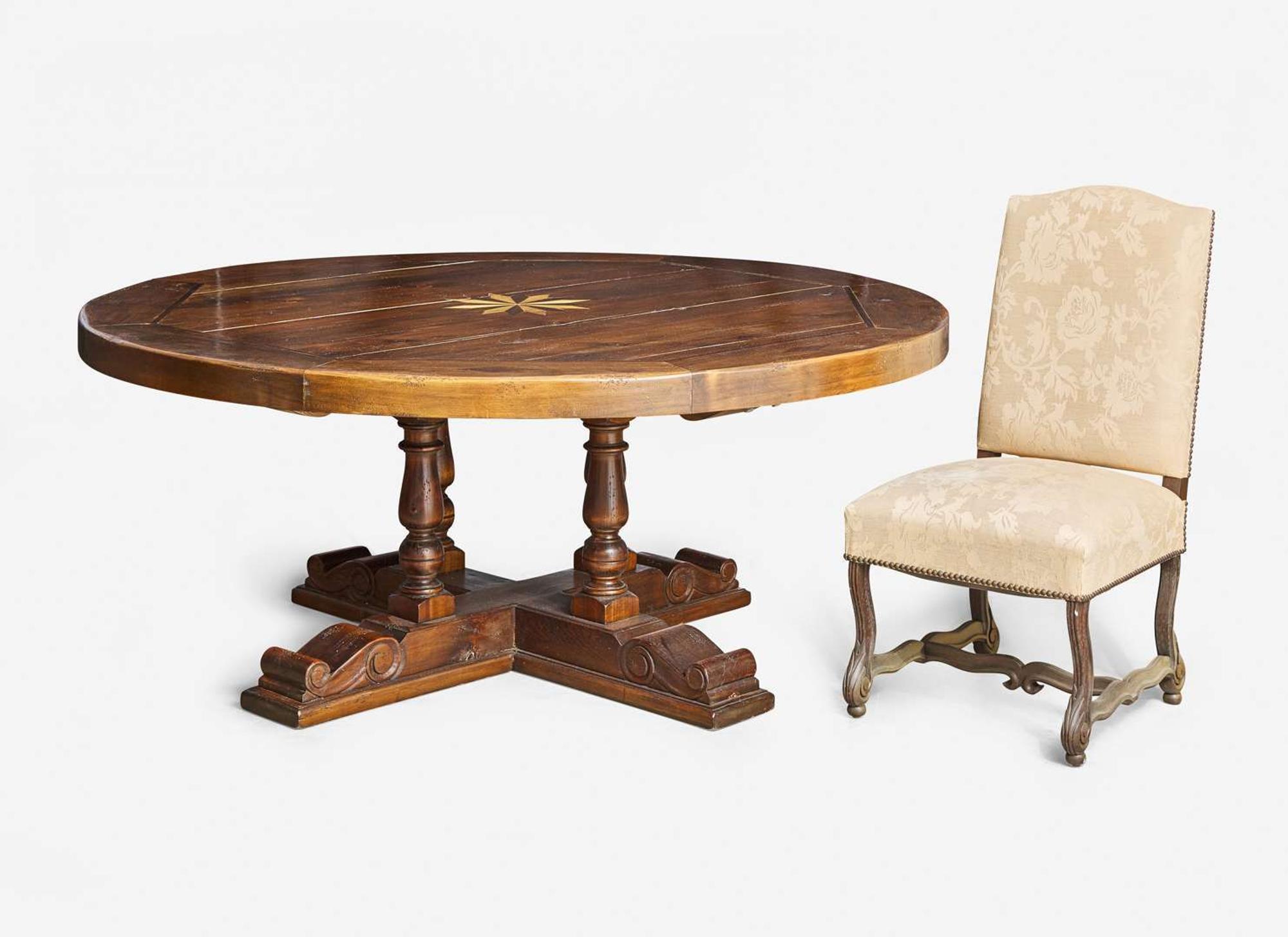 A Baroque style circular pine dining table together with a set of five Baroque style upholstered wood dining chairs, modern