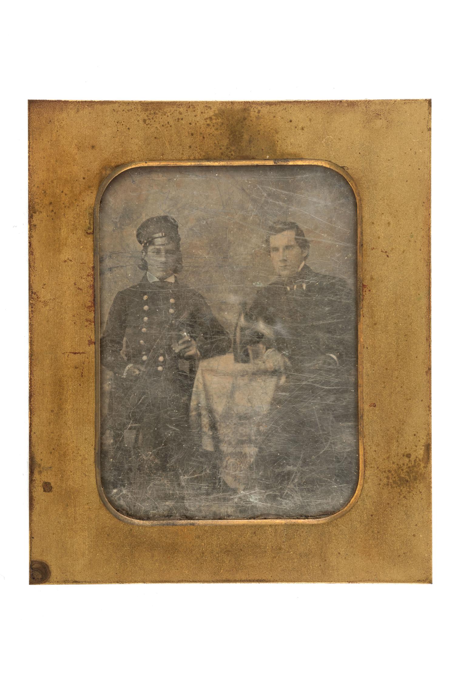 [EARLY PHOTOGRAPHY]. A group of 3 daguerreotypes in uniform, highlighted by half plate daguerreotype of uniformed subject sharing a drink with a civilian.
