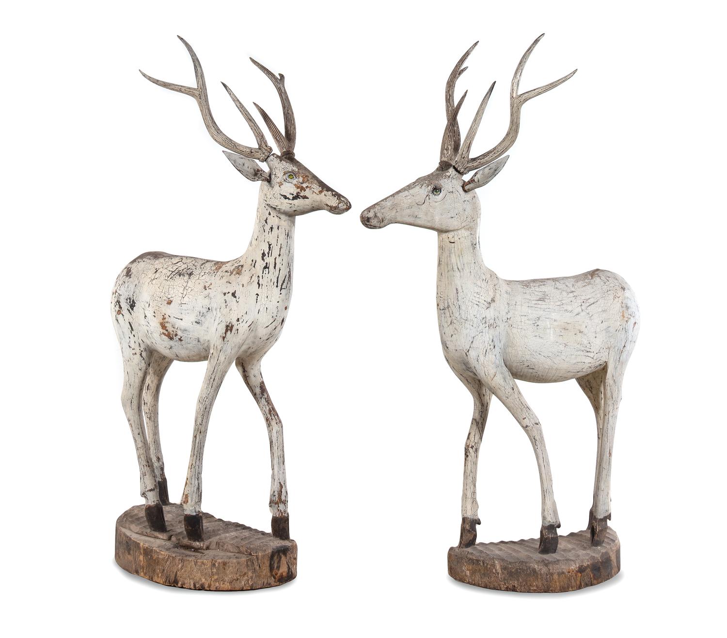 A Pair of Carved and Painted Figures of Deer