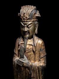 A Pair of Chinese Gilt Decorated Bronze Figures of Standing Officials