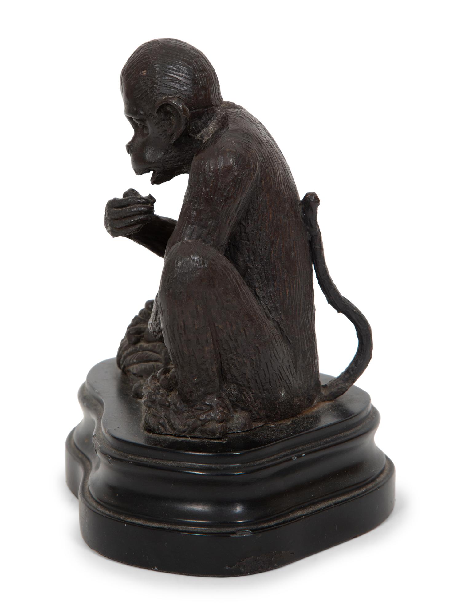 A Continental Bronze Sculpture of a Seated Monkey