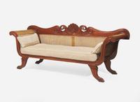 An Anglo-Colonial carved hardwood and caned sofa, first half 19th century