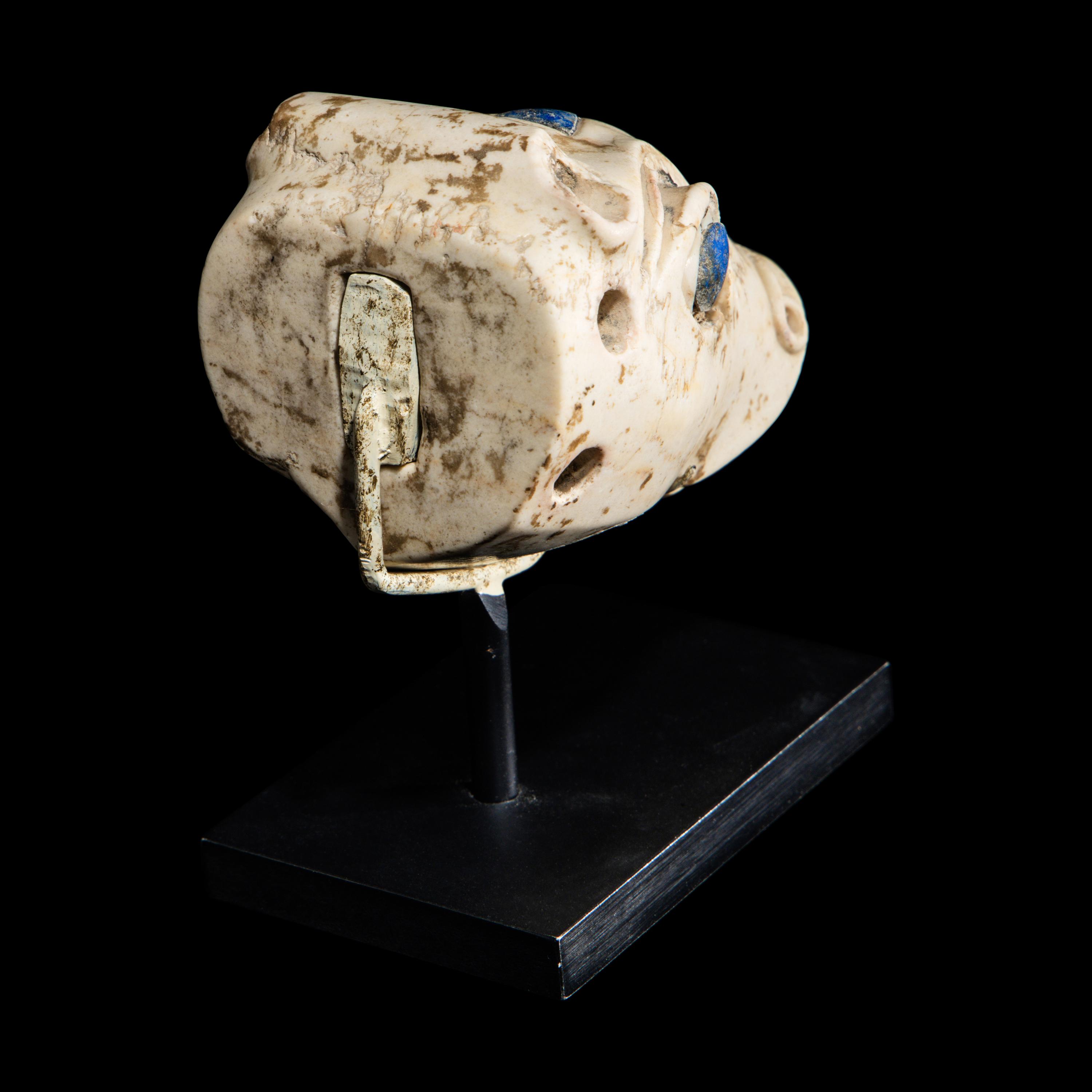 A Mesopotamian Marble and Lapis Lazuli Inlay Bull Head