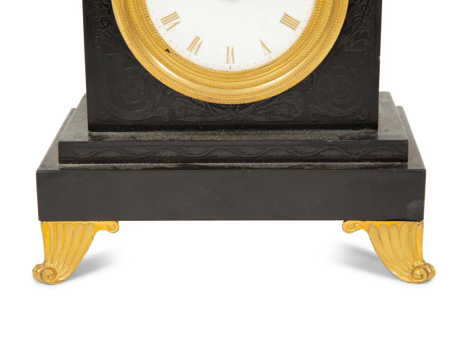 A Regency Black Slate and Gilt Bronze Mantel Clock