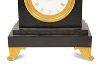 A Regency Black Slate and Gilt Bronze Mantel Clock