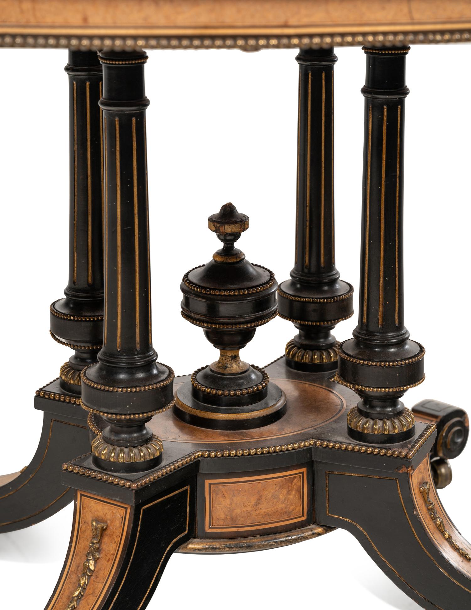 A Continental Parcel Ebonized Center Table