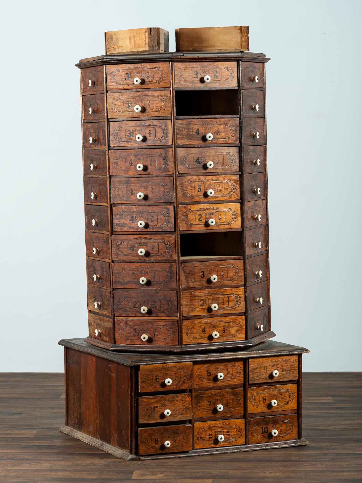 An American Bolt and Screw Case Company Stenciled Pine Octagonal Rotating Cabinet