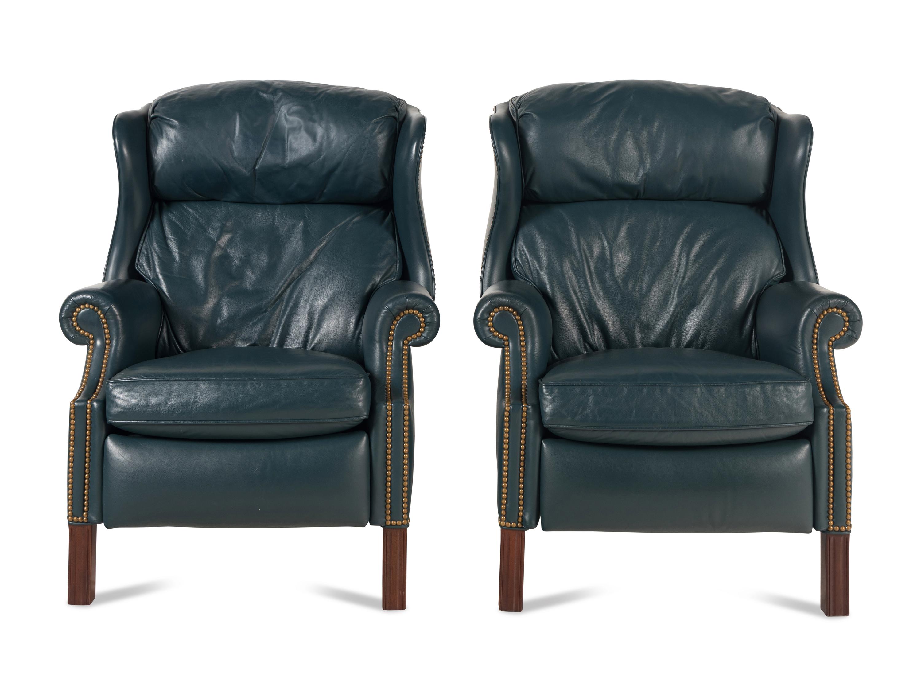 A Pair of George III Style Mahogany and Leather Upholstered Reclining Wingback Chairs