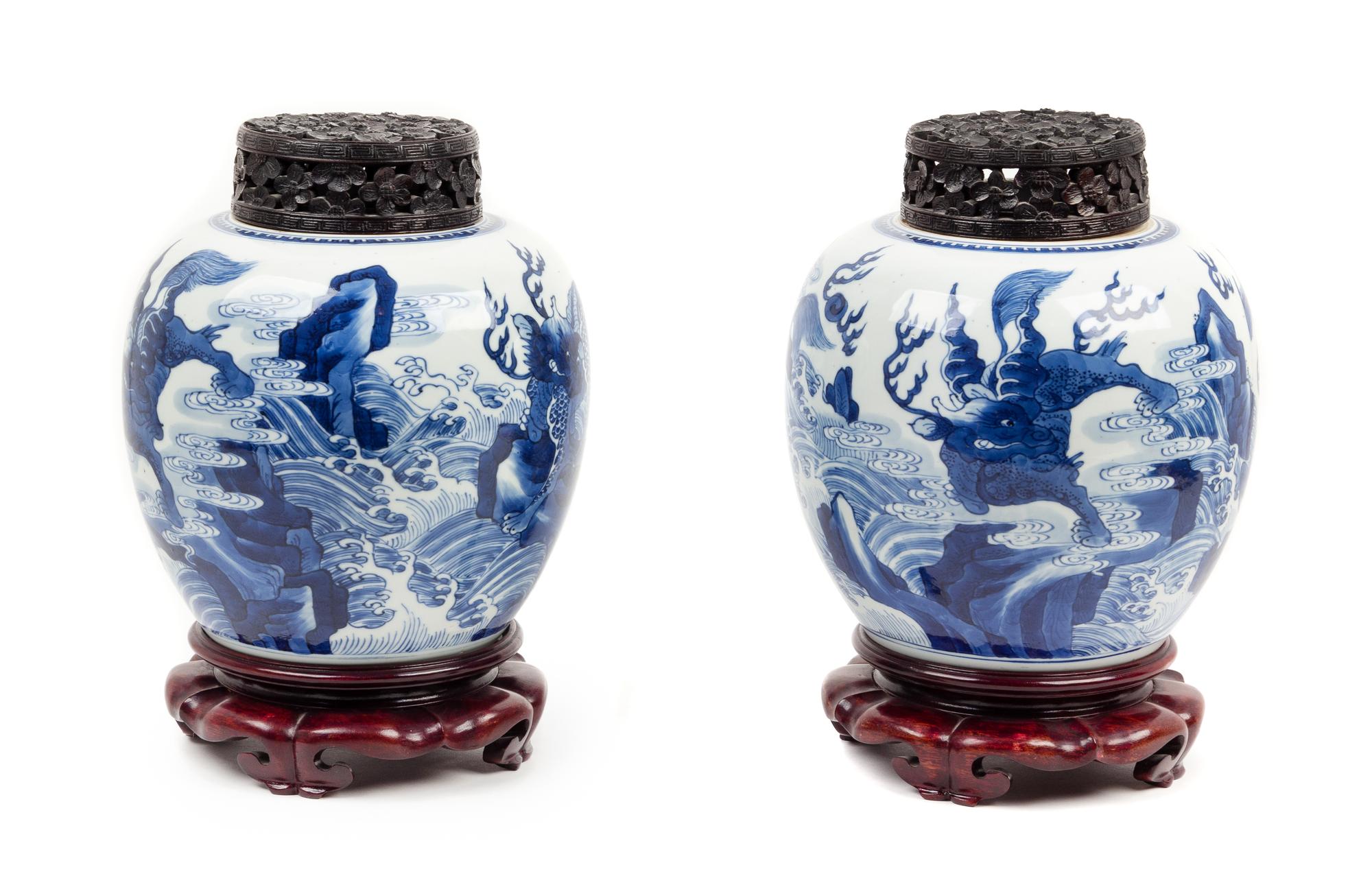 A Pair of Blue and White 'Mythical Beast' Porcelain Ginger Jars Height 8 1/2 inches. — KANGXI PERIOD (1662-1722)