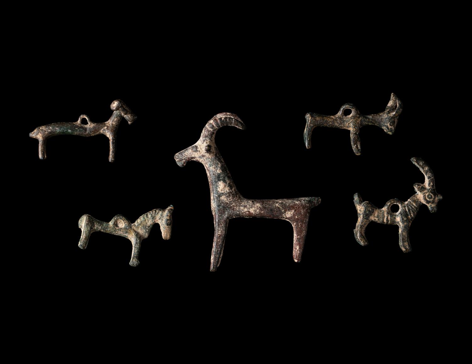 A Group of 7 Luristan Bronze Objects Including Animal Figures and Spearheads
