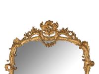 A Rococo Revival Giltwood Mirror