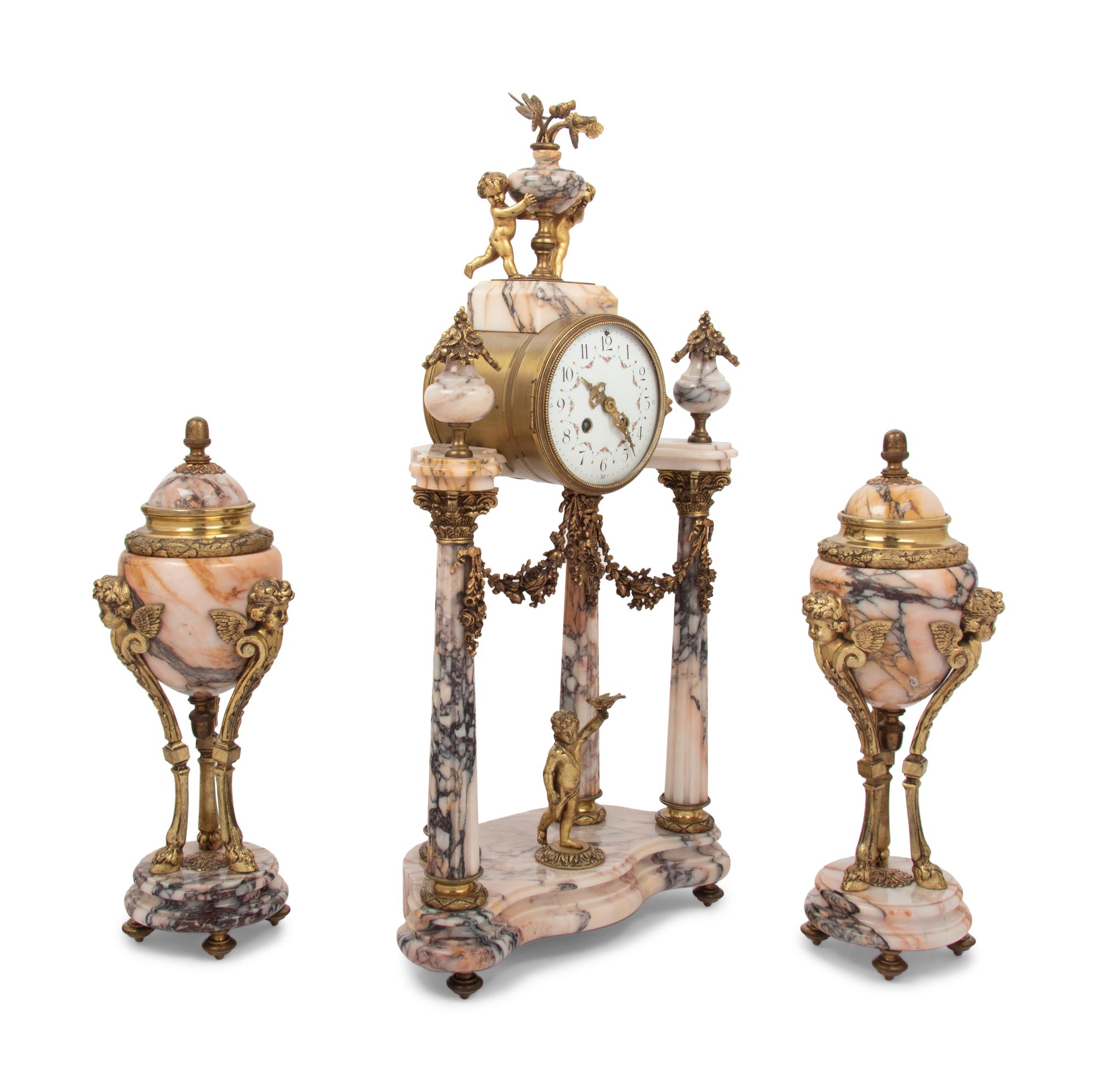 A Louis XVI Style Gilt Metal Mounted Marble Clock Garniture
