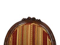 Four Louis XVI Style Carved Walnut Chairs