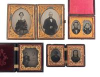 [EARLY PHOTOGRAPHY]. A group of 12 daguerreotypes, ambrotypes, and tintypes of couples housed in 8 cases, including some Union cases.