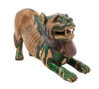 A Chinese Green and Straw Glazed Pottery Figure of a Fu Lion