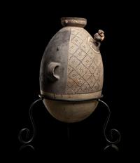 A Chancay Bichrome Vessel with Monkey Figure
