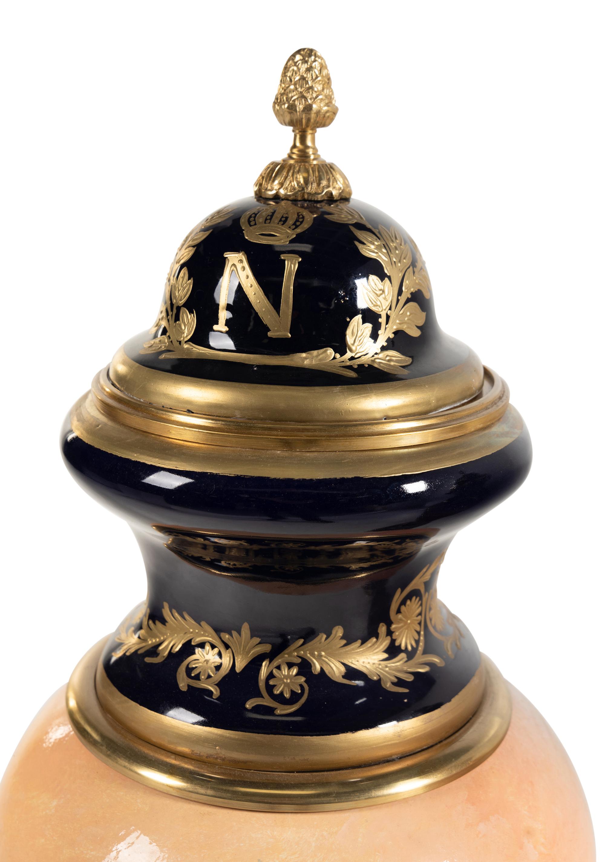 A Pair of Gilt Bronze Mounted Sèvres Style Porcelain Urns