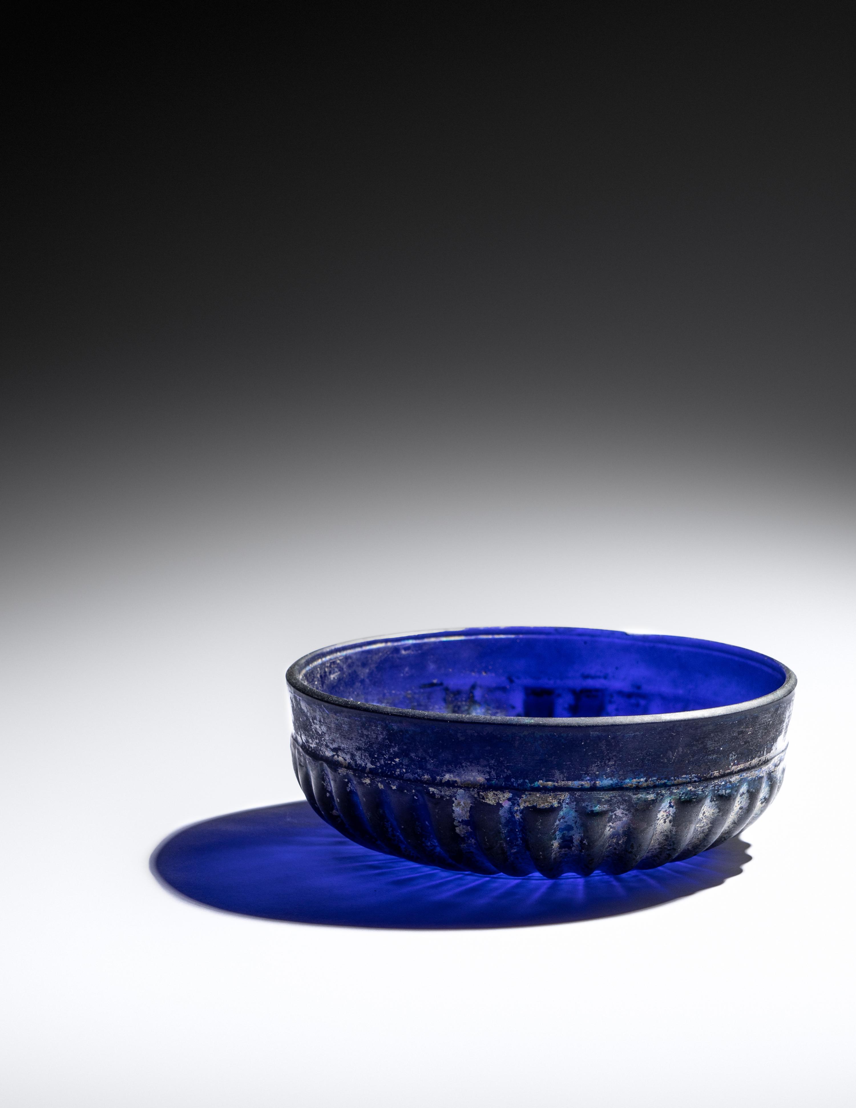 A Roman Cobalt Blue Molded Glass Bowl