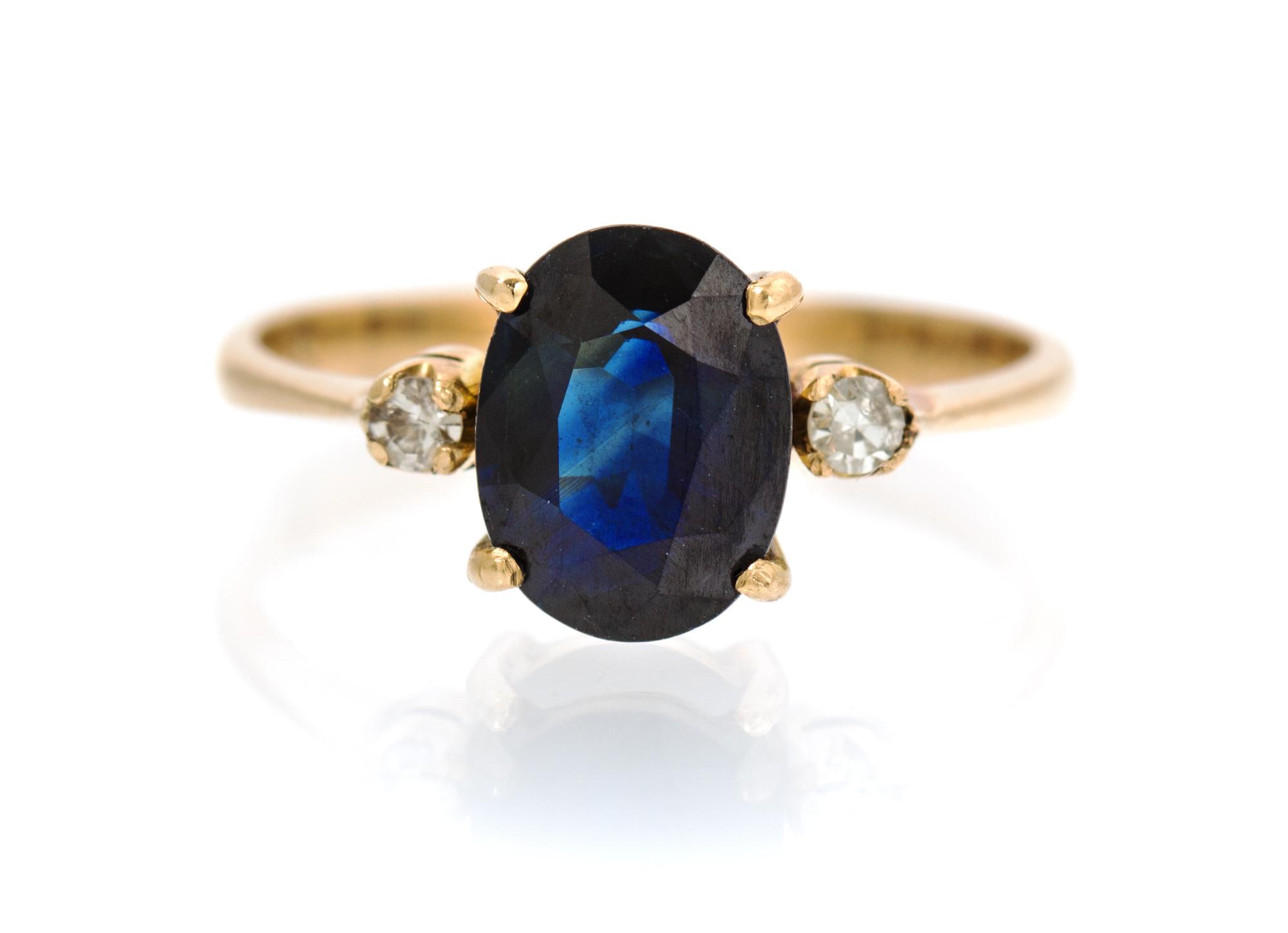 A 14 Karat Yellow Gold, Sapphire and Diamond Ring, 1.30 dwts.