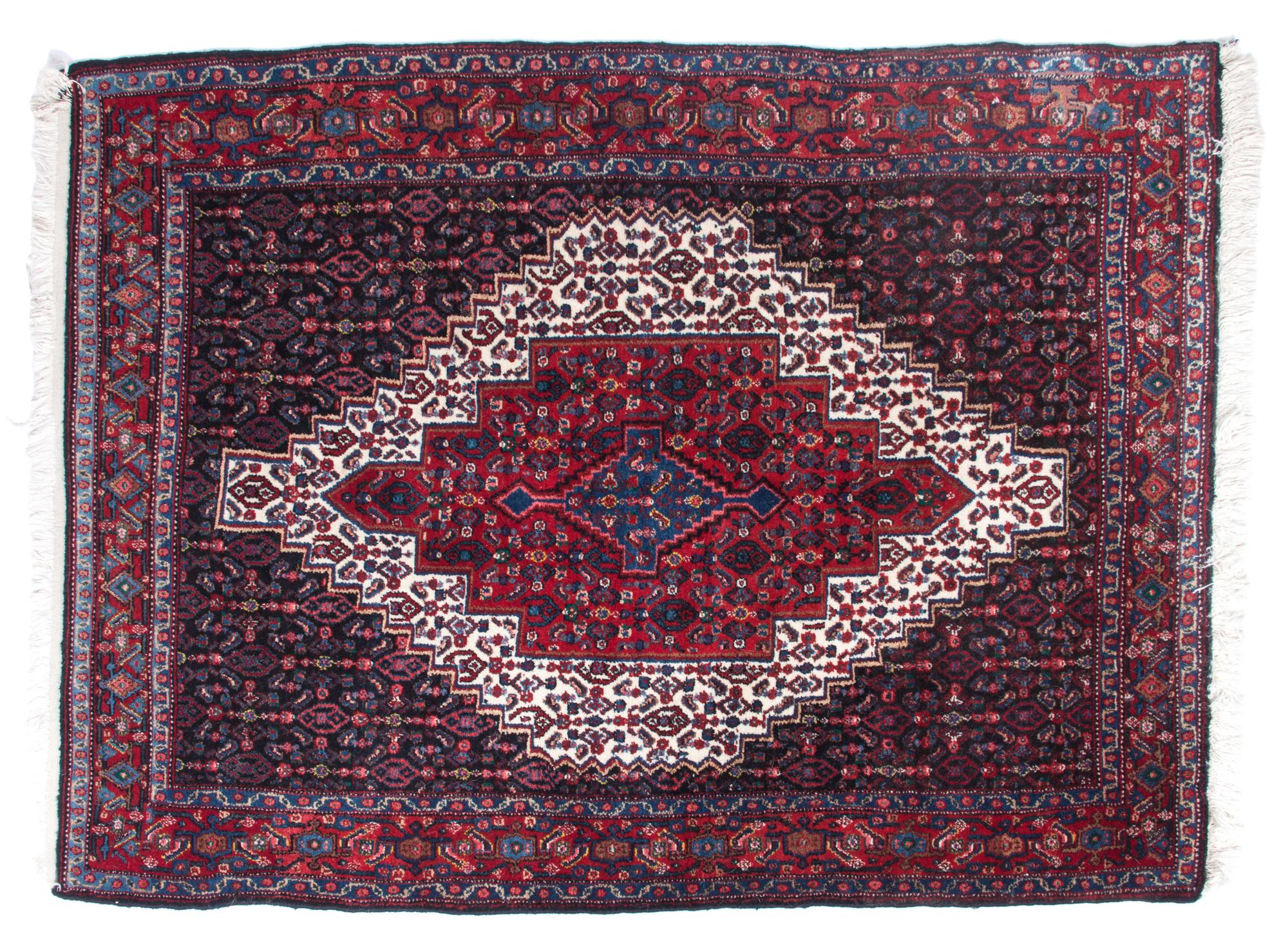 An Iranian Rug 5 feet 4 1/2 inches x 4 feet.