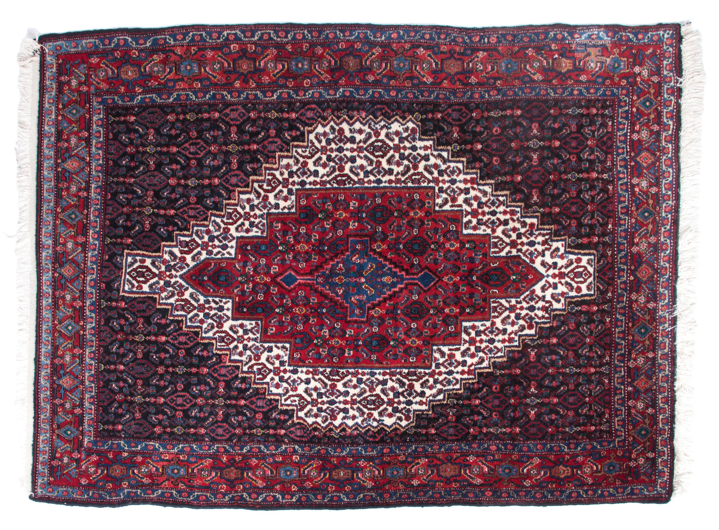 An Iranian Rug 5 feet 4 1/2 inches x 4 feet.