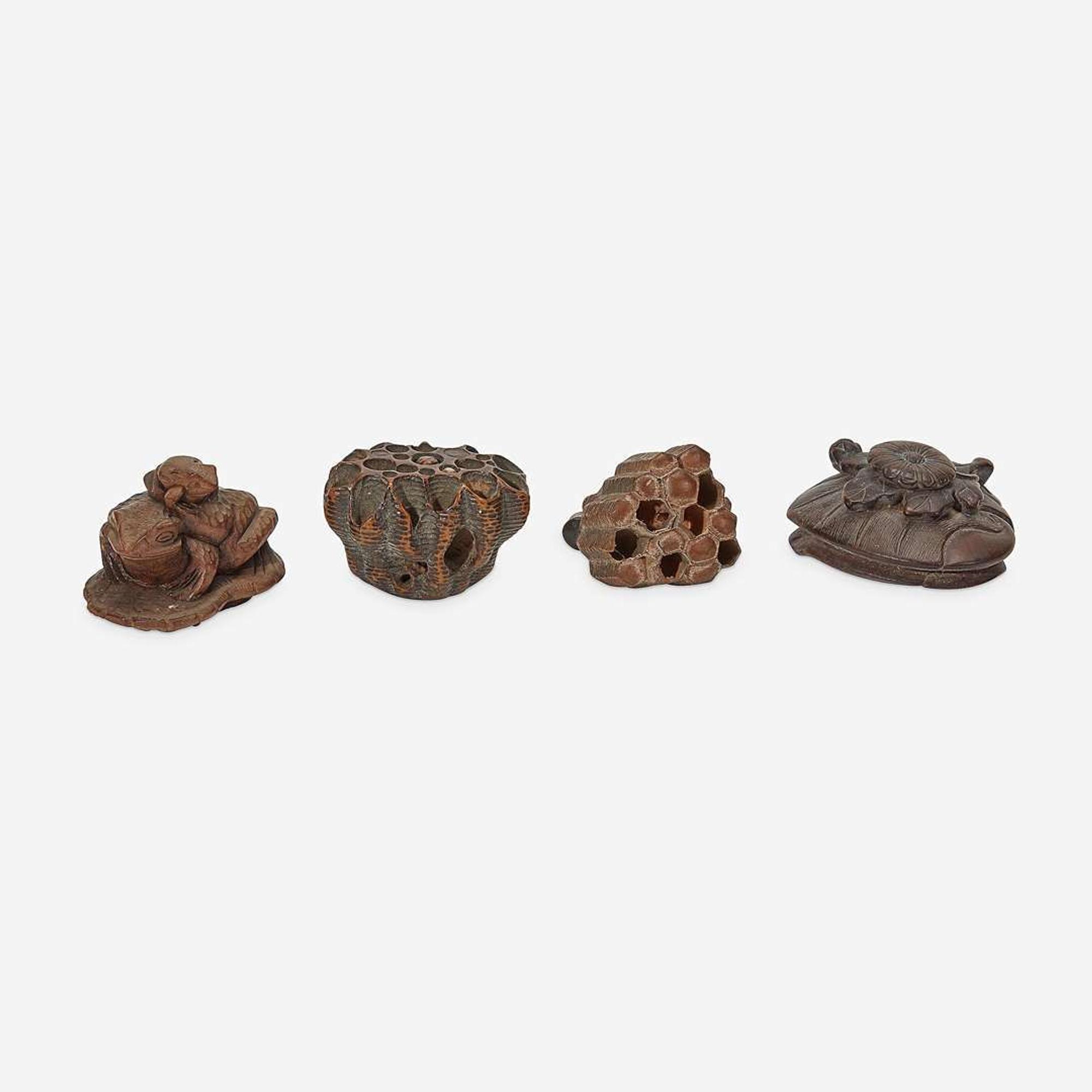 Four assorted Japanese carved wood netsuke