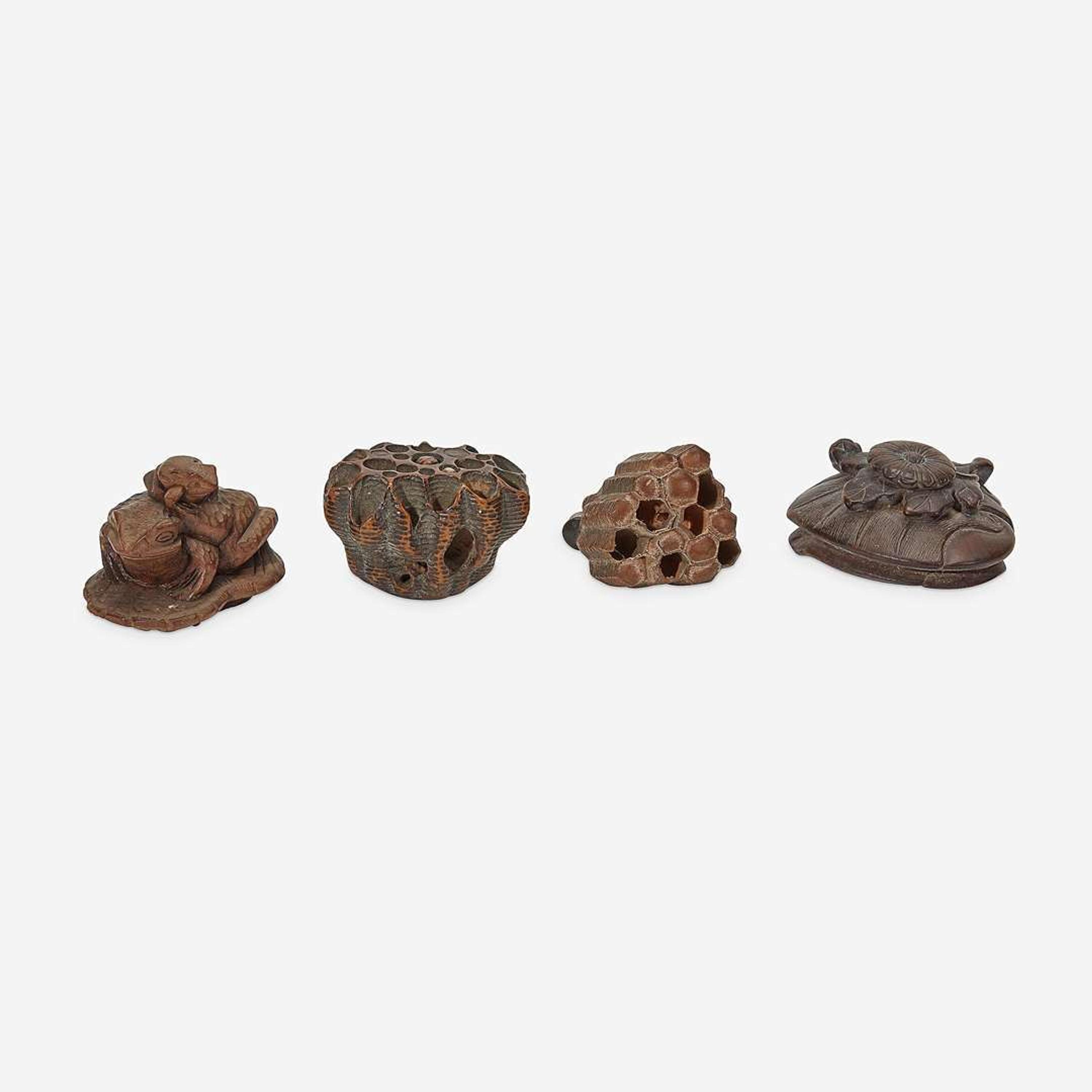 Four assorted Japanese carved wood netsuke