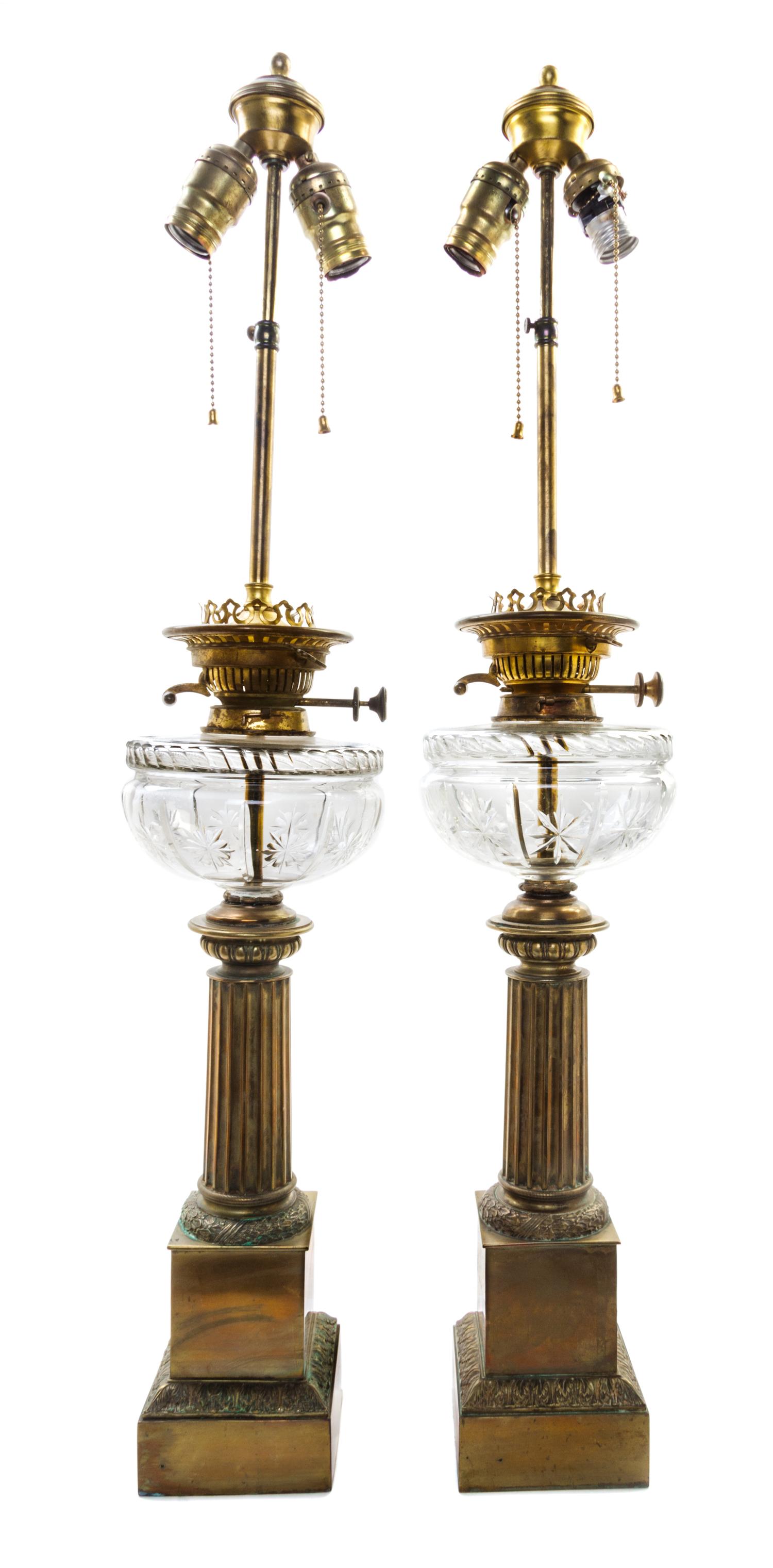 A Pair of Continental Gilt Metal Oil Lamp Bases Height overall 33 3/4 inches. — 19TH CENTURY AND LATER