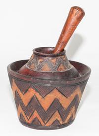 A Bobo Carved Wood Mortar & Pestle. Diameter 8 1/2 inches.