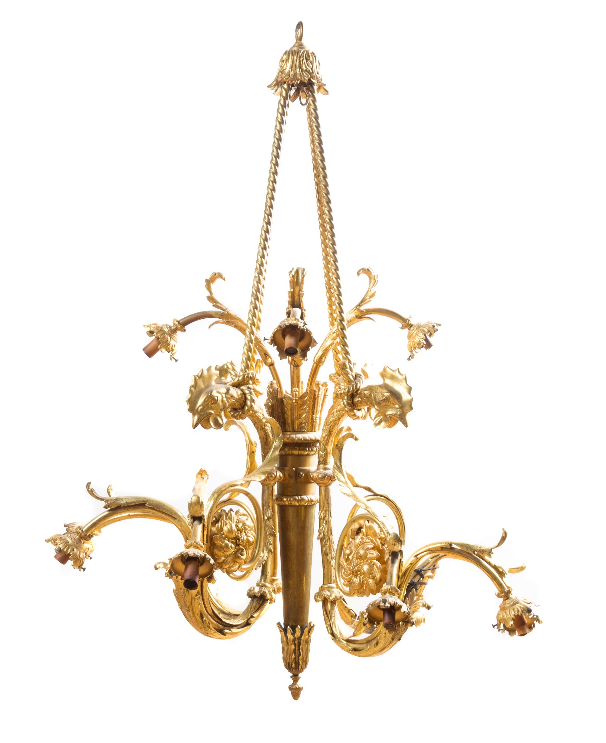 A Neoclassical Gilt Bronze Twelve-Light Chandelier Height 42 x diameter 35 inches.