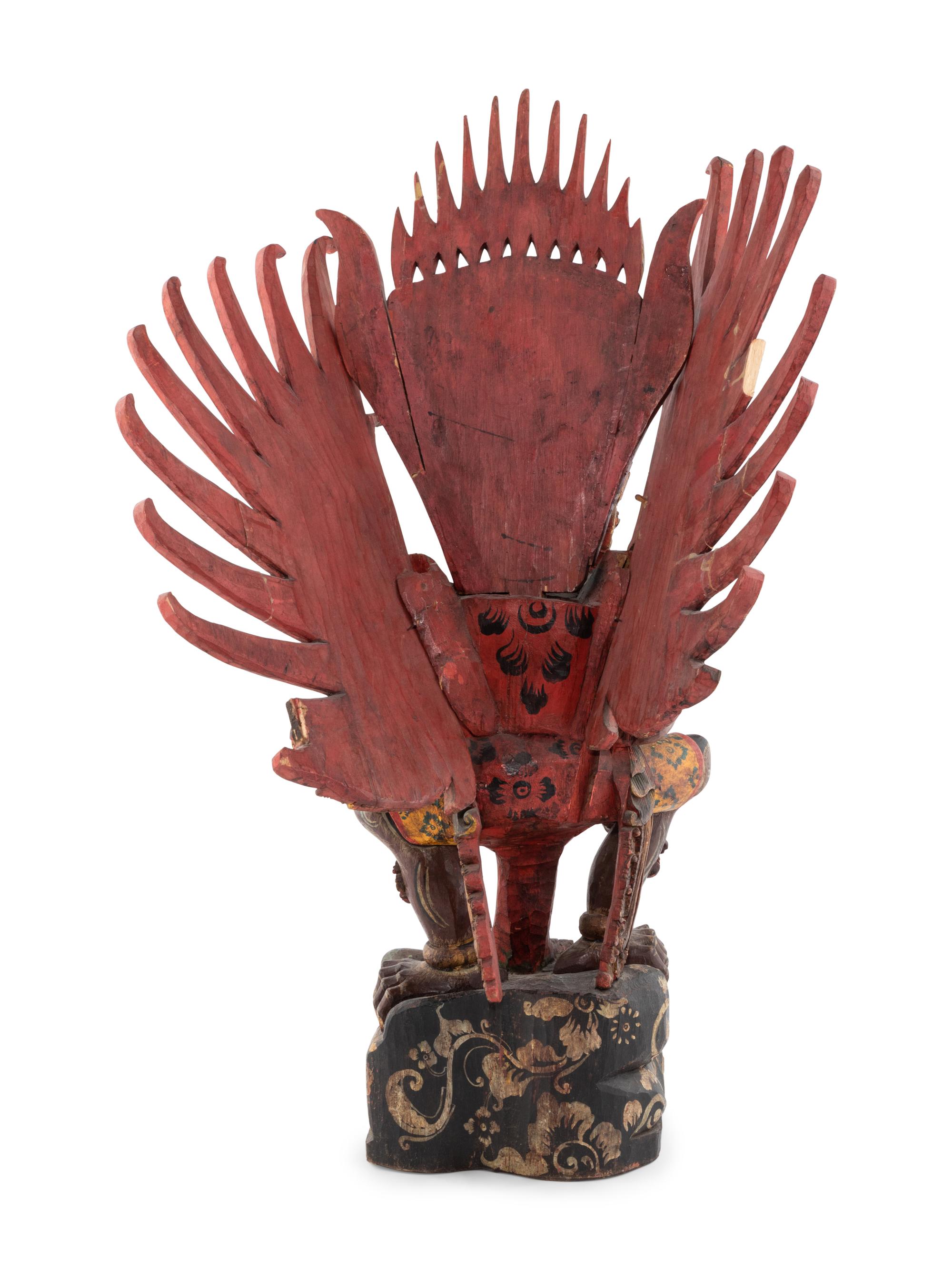 An Indian Carved and Polychrome Painted Wood Garuda Figure