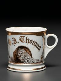 A Porcelain Occupational Shaving Mug Depicting a Bushel of Oysters