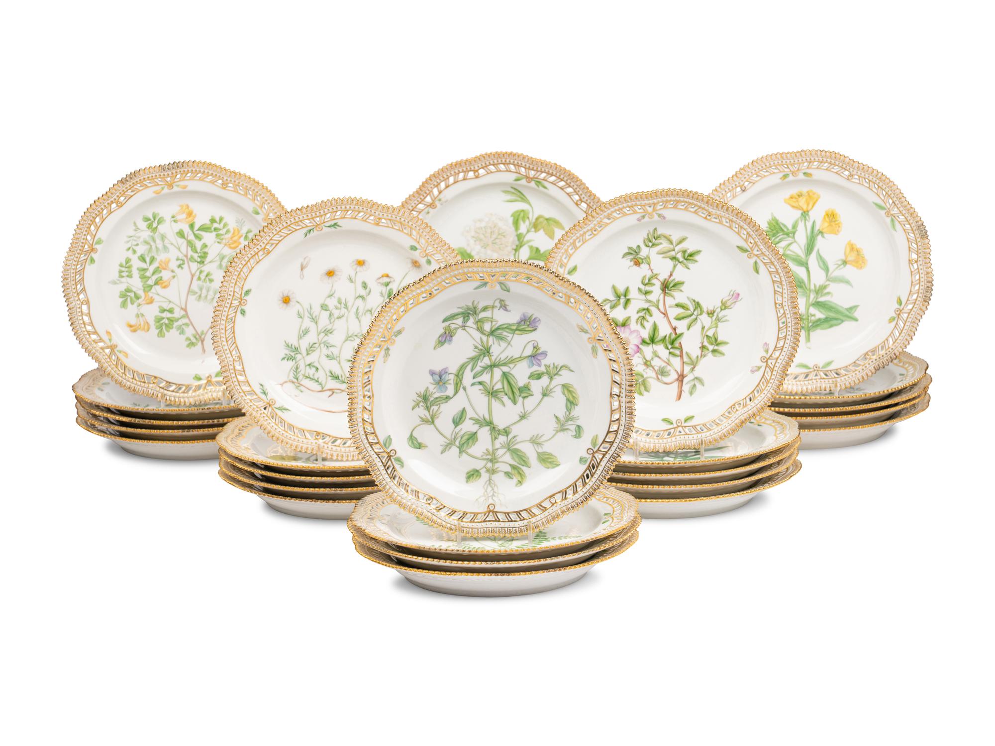 A Set of Twenty-Nine Royal Copenhagen Flora Danica Reticulated Porcelain Dinner Plates