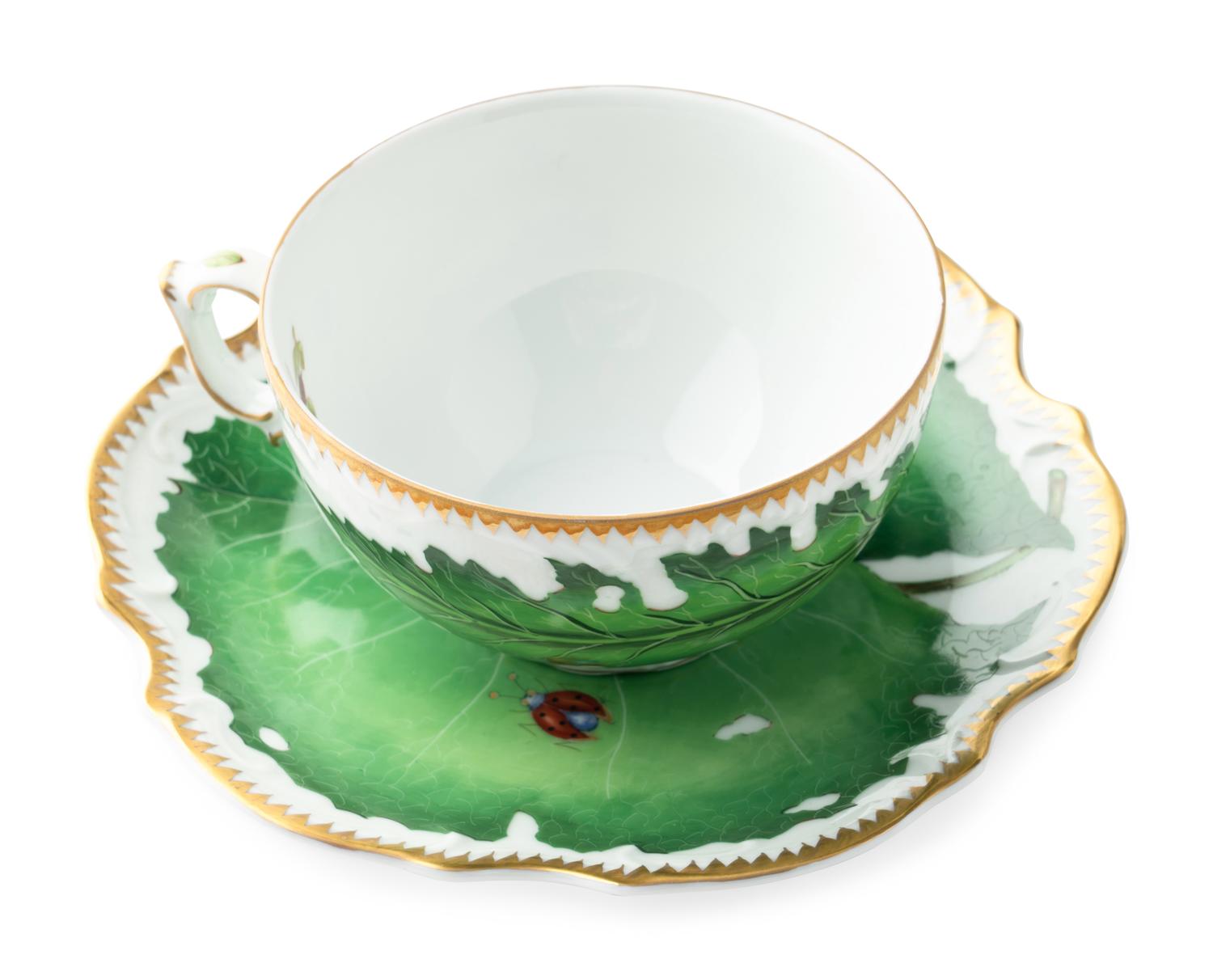 An Anna Weatherley Green Leaf Porcelain Dinner Service