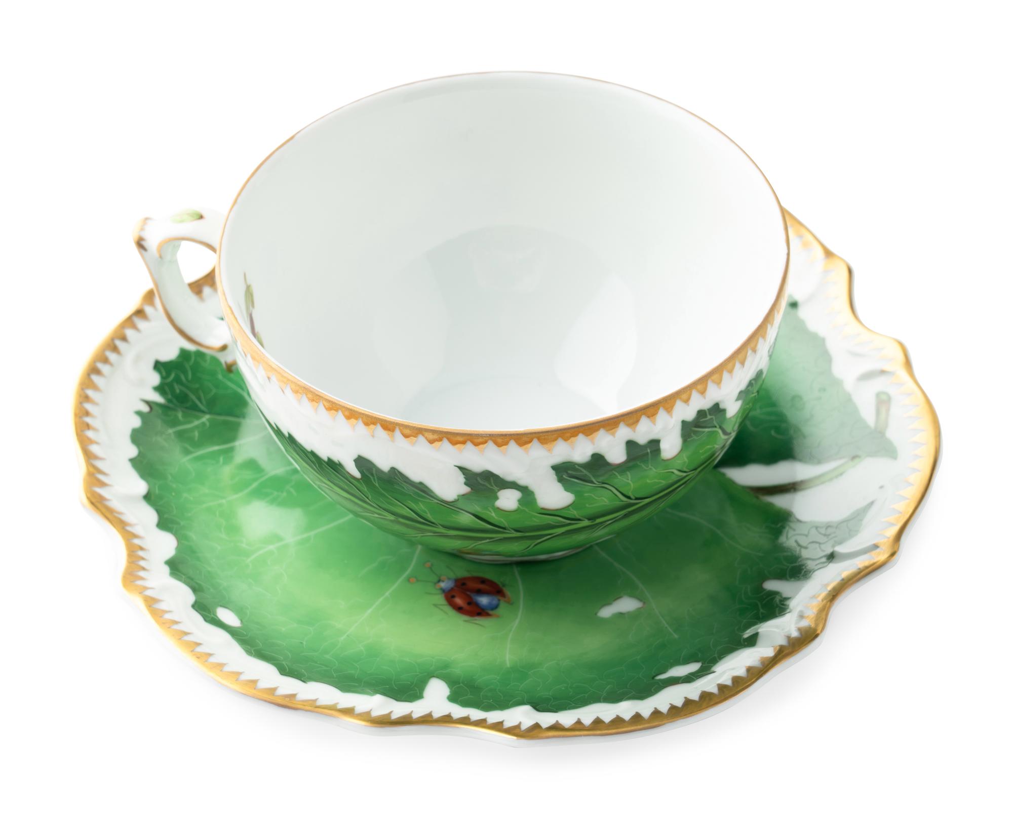 An Anna Weatherley Green Leaf Porcelain Dinner Service