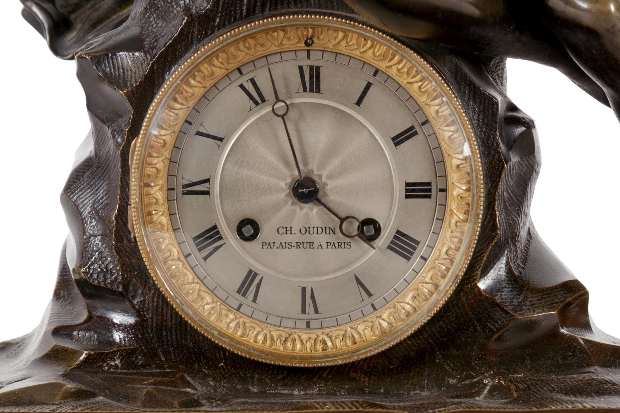 An Empire Style Gilt and Patinated Bronze and Marble Clock Garniture