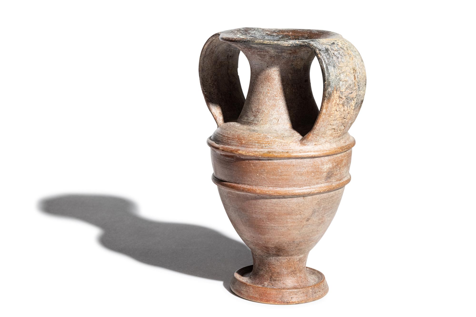 An Etruscan Painted Amphora with Animal Procession Handles