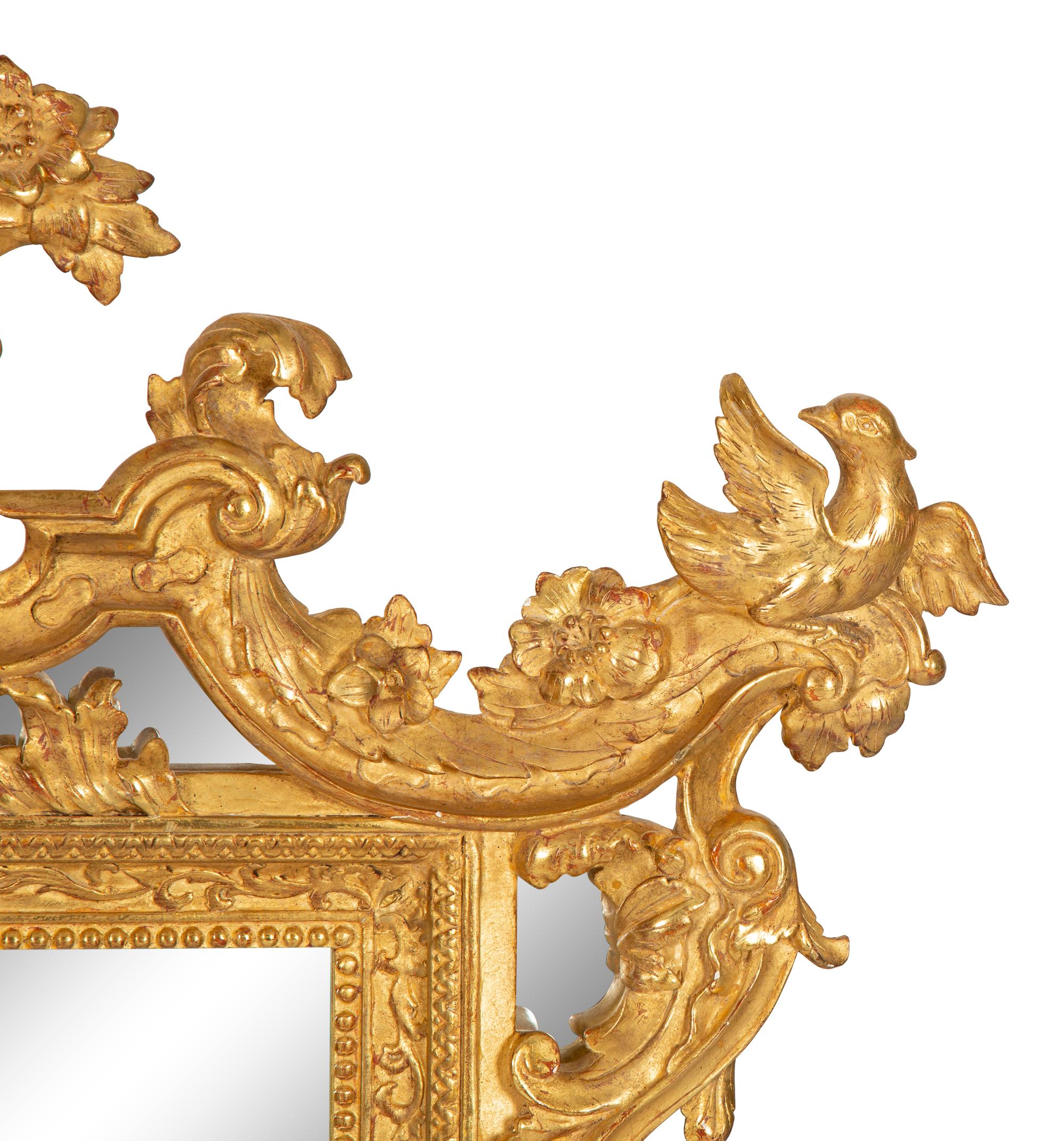 An Italian Baroque Style Giltwood Mirror