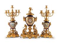 A French Gilt Bronze and Sèvres Style Porcelain Clock Garniture