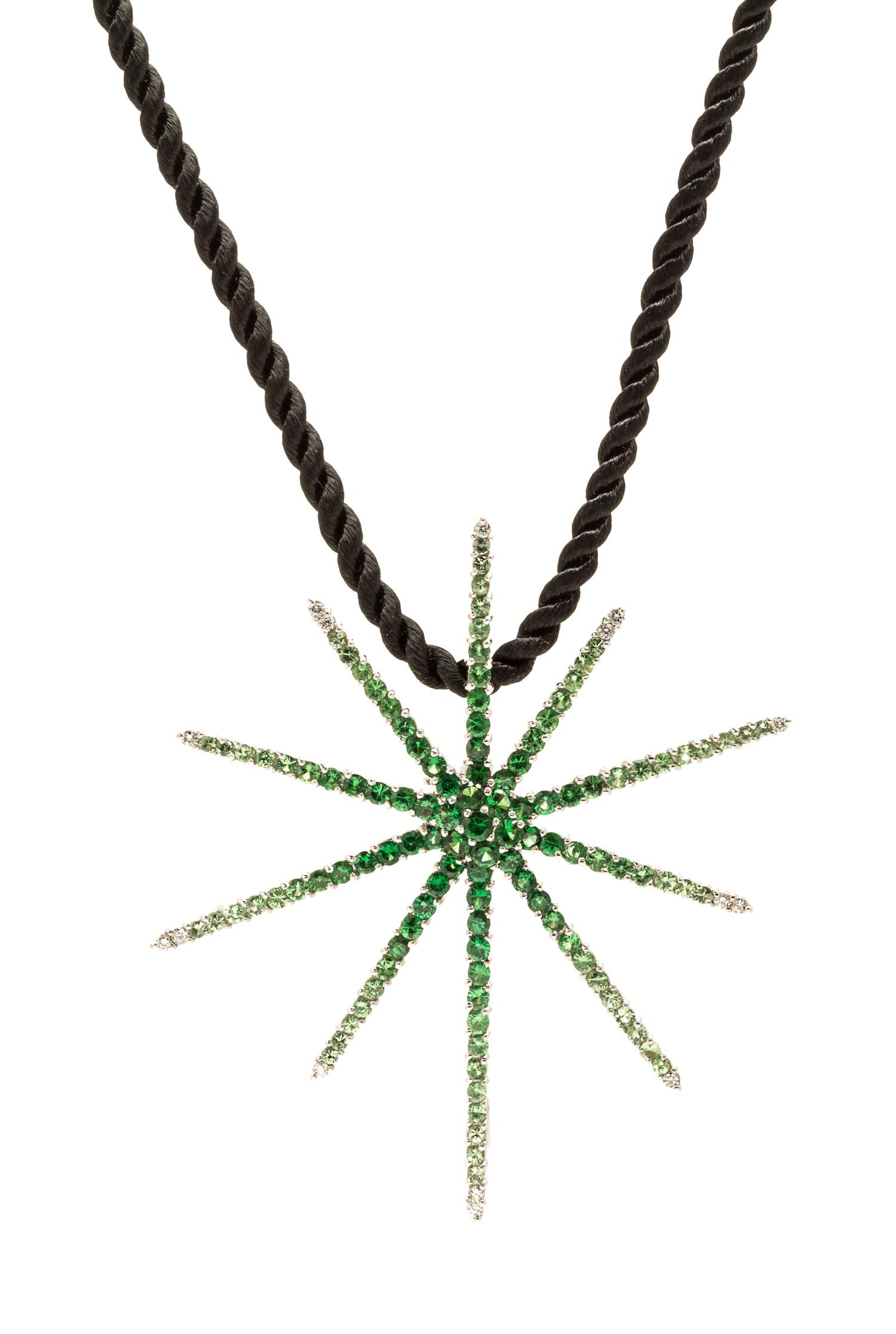 An 18 Karat White Gold, Tsavorite Garnet and Diamond Pendant/Brooch, 6.30 dwts.