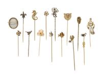 COLLECTION OF STICKPINS AND A BROOCH