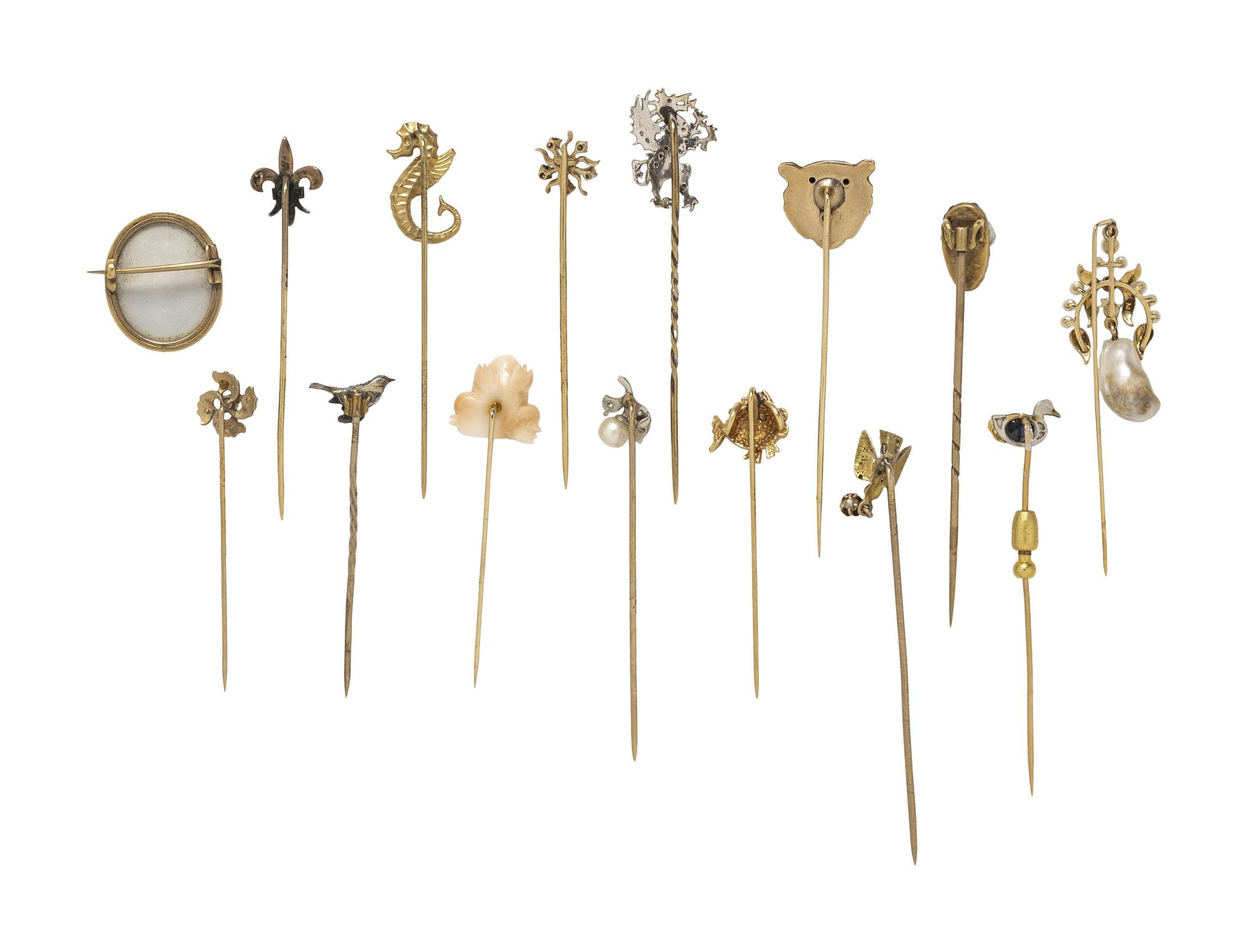 COLLECTION OF STICKPINS AND A BROOCH