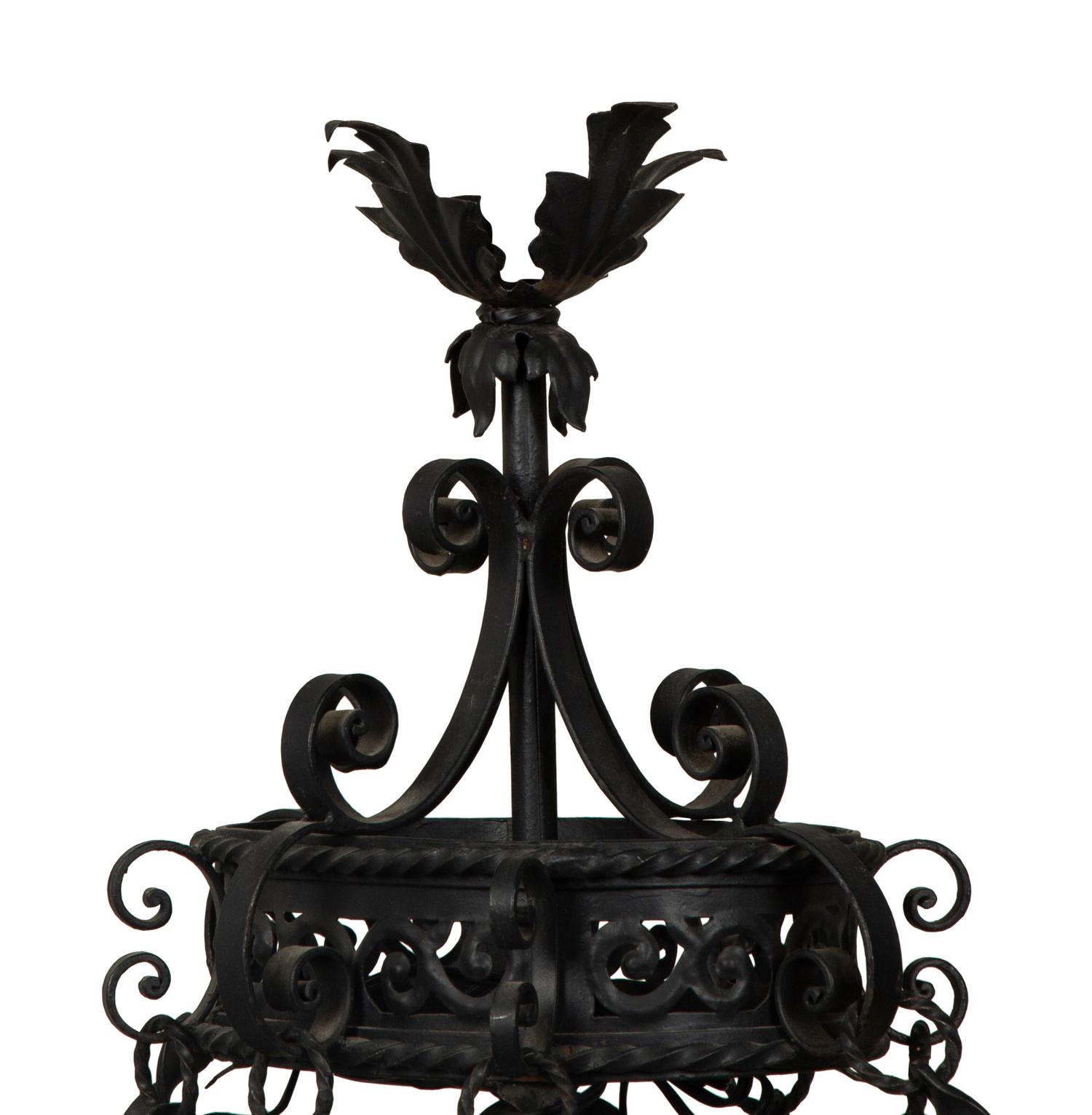 A Wrought Iron Chandelier in the Style of Addison Mizner — 20th Century