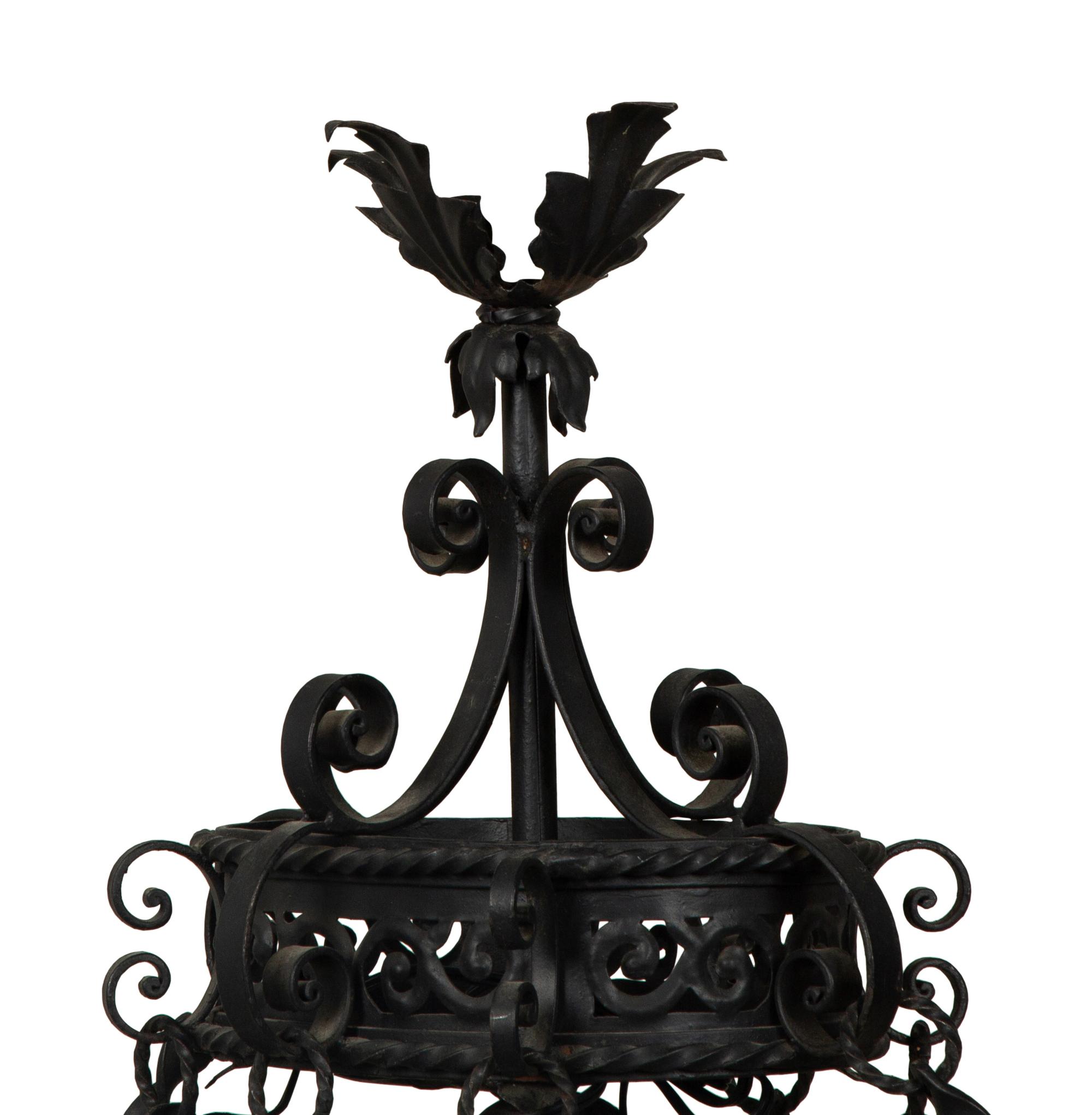 A Wrought Iron Chandelier in the Style of Addison Mizner — 20th Century