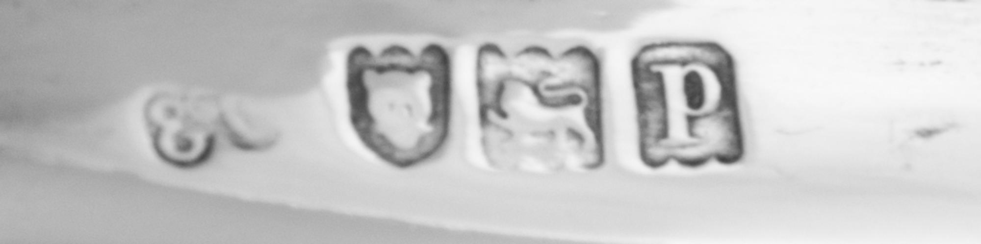 A Set of Twelve English Silver Plates , Elkington & Co., London, 1910 , each having pierced foliate scroll borders.