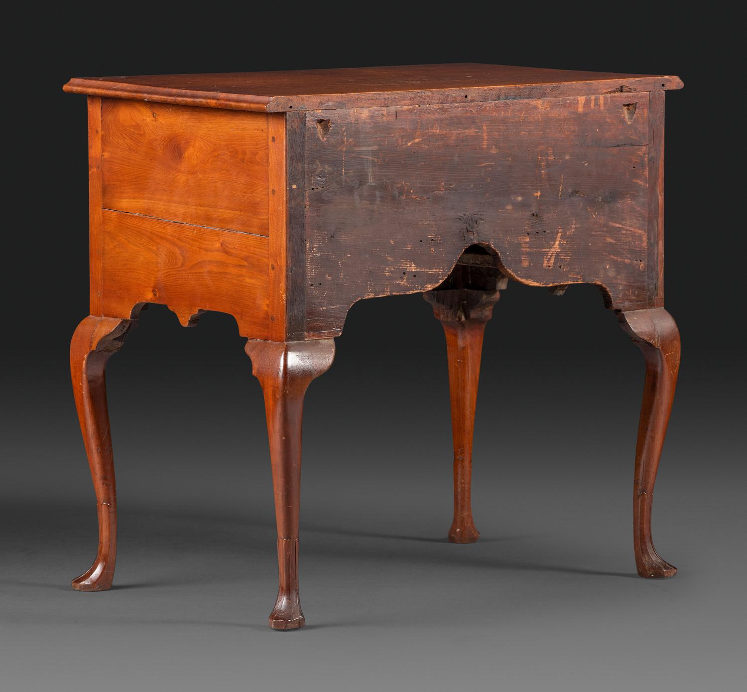 A Queen Anne Carved and Figured Walnut Dressing Table