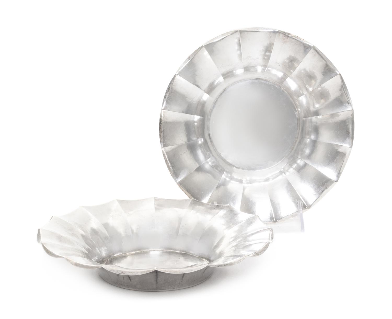 A Pair of Continental Silver Bowls, Likely German, 1920, each of shallow, circular form with fluted sides, having a spot-hammered finis