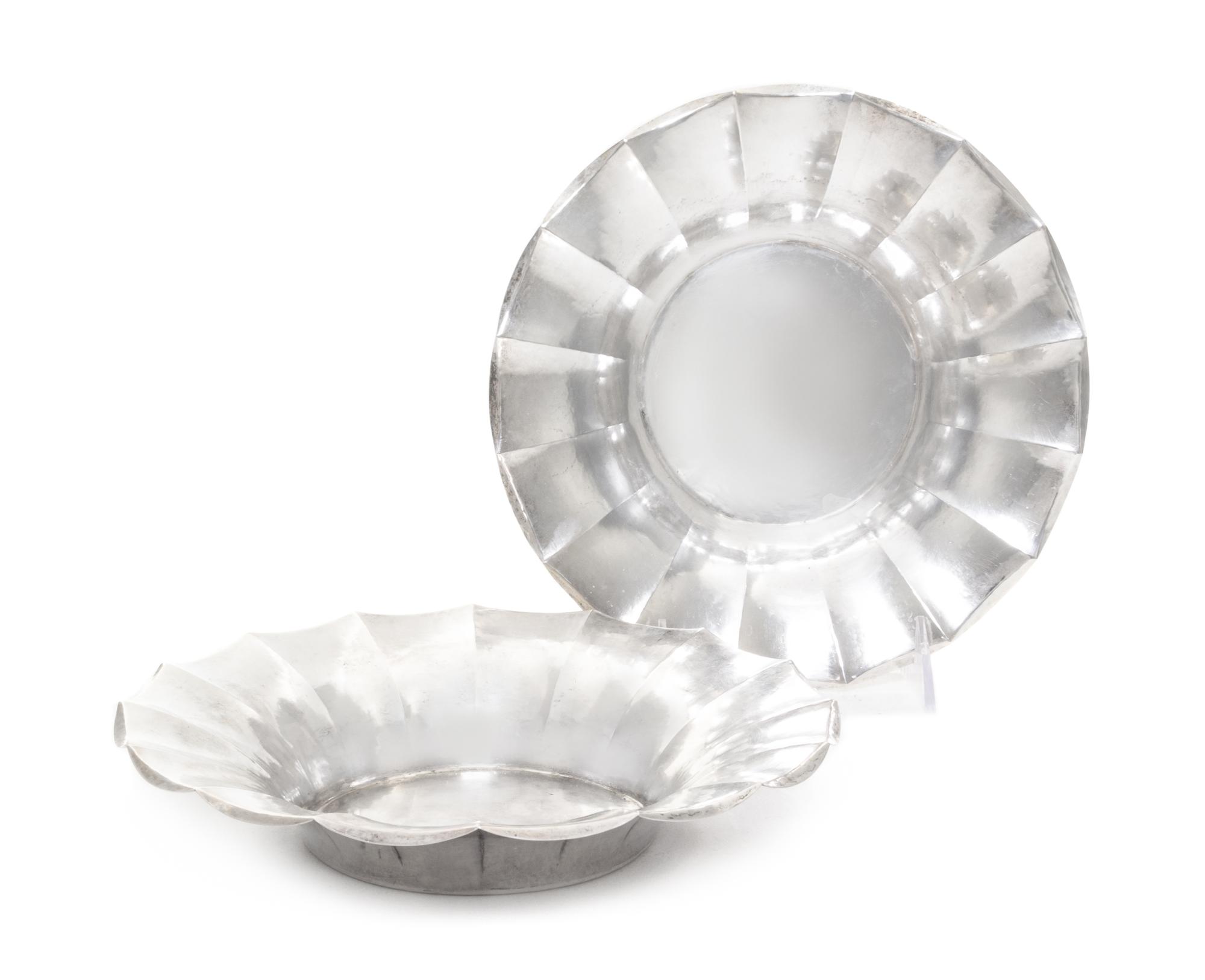 A Pair of Continental Silver Bowls, Likely German, 1920, each of shallow, circular form with fluted sides, having a spot-hammered finis