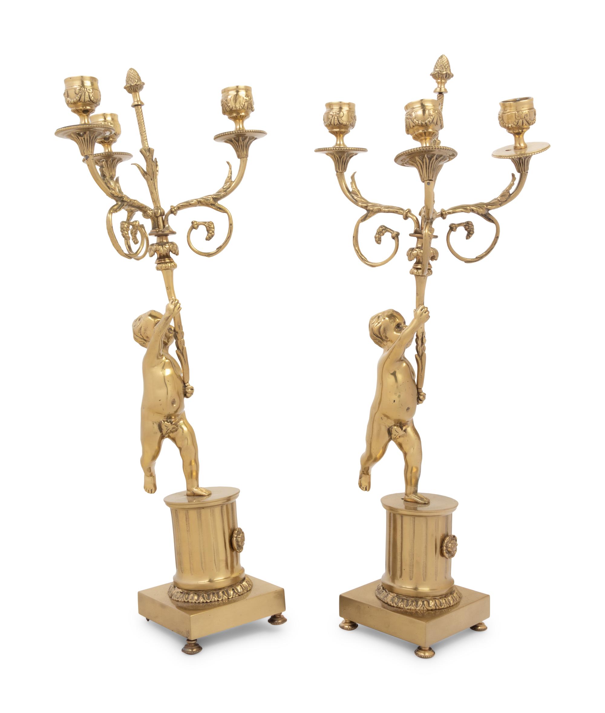 A Pair of Louis XV Style Gilt Metal Three-Light Candelabra