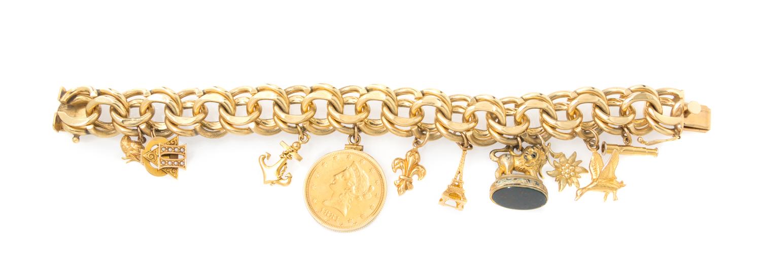 A 14 Karat Yellow Gold Charm Bracelet with Ten Charms, 96.90 dwts.